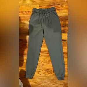 Lululemon high rise jogger in olive. Never worn. Brand new.
